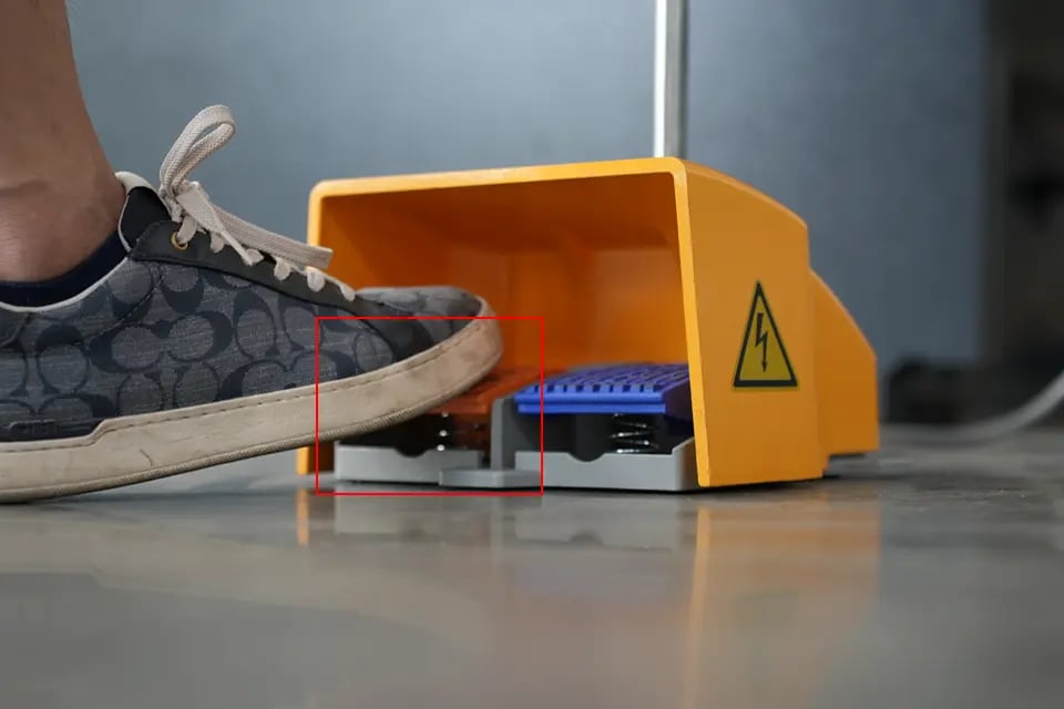 Depress the return switch on the left