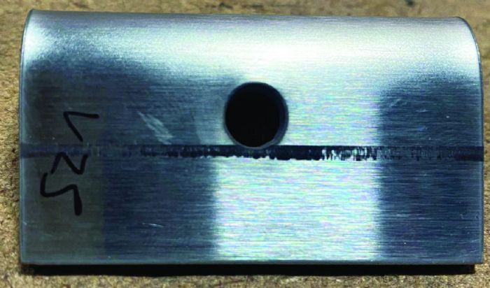 Fig. 2 - One way to prevent hole deformation: Pilot a hole and then drill it out to size after the part has been bent. In this part, a ¼-in.-dia. pilot hole was made during blanking, with a larger hole drilled post-forming.