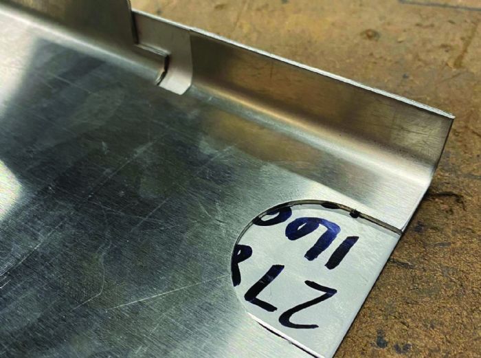 Fig. 6 - To employ a “sacrificial backer,” place a blank under the workpiece to add support through the bending cycle.