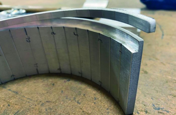 Fig. 8 - Press brake operators can prevent deformation on a machined surface by using a sacrificial blank to take up the space.